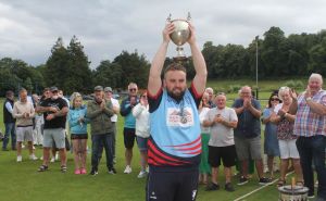 Ross Hunter lifts trophy aloft